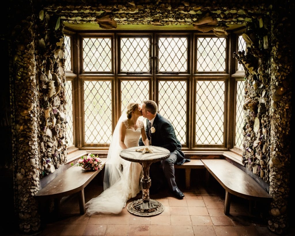 Wedding couple kissing inside shell cottage at Cliff at Lyons