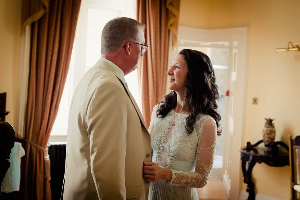 Eloping couple gaze at each other in Kinnitty Castle