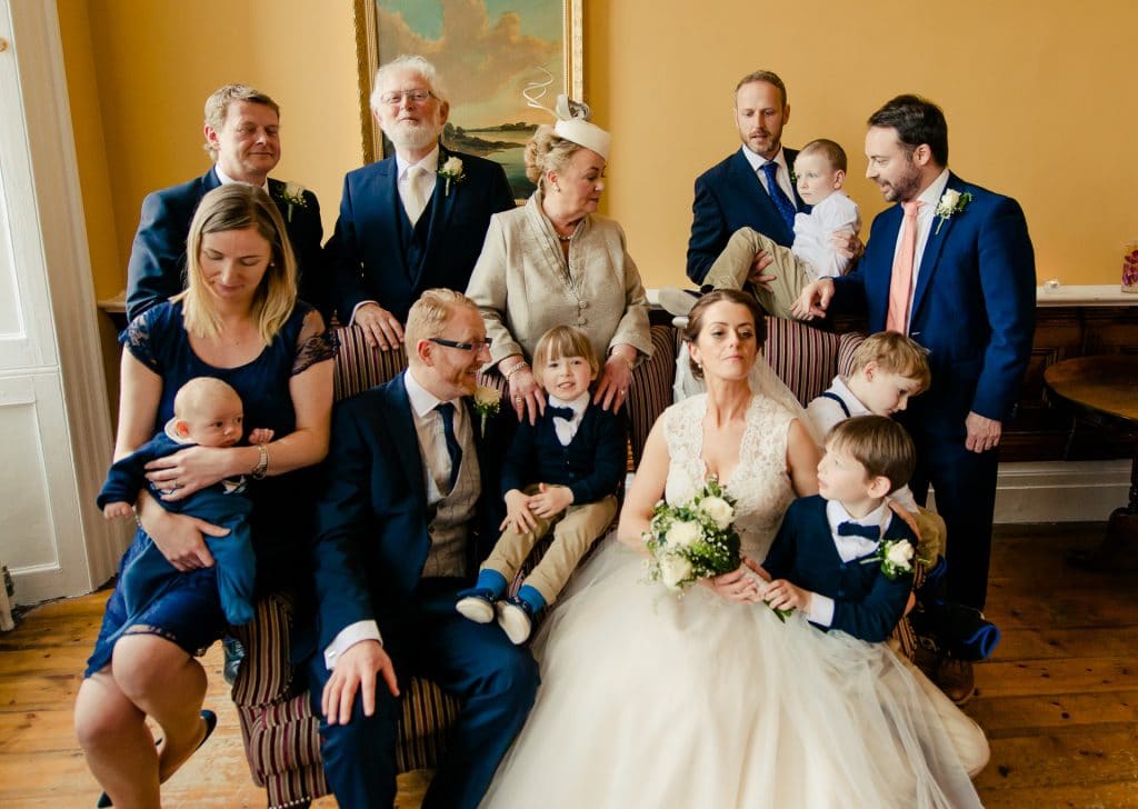 Funny wedding group photo with only 1 person out of 13 looking at camera