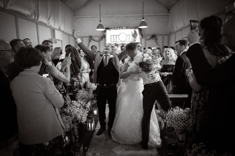 Almight celebrations walking down wedding aisle